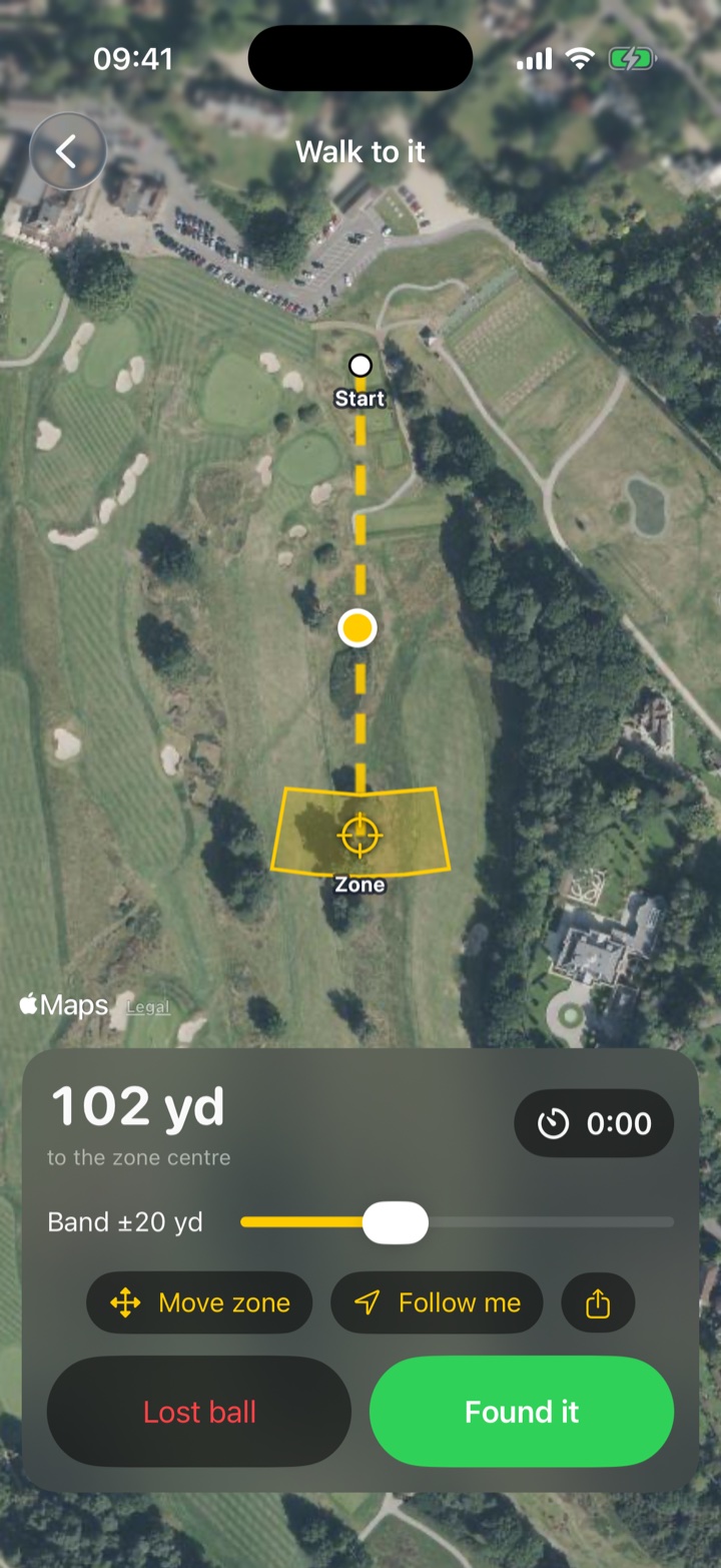 Ball Bearing’s map screen: a satellite view of a golf hole with a dotted yellow line from the tee to a yellow search zone among the trees, the golfer’s dot halfway along, and 102 yards to go.